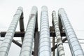 Heating pipes. City communications. Lots of stainless steel sheathed pipes. Industrial equipment Royalty Free Stock Photo