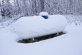 Propane Tank Covered With Snow