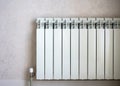 Heating radiator on light wall background Royalty Free Stock Photo