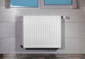 Heating radiator under window Royalty Free Stock Photo