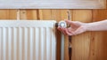 Modern radiator on wooden wall in house with cozy interior Royalty Free Stock Photo