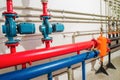 Heating system in a boiler room. powerful pumps red and blue tubes pipe Royalty Free Stock Photo