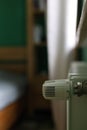 Regulator of heating system radiator in the bedroom Royalty Free Stock Photo
