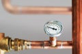 Heating system`s cooper pipes with Thermometer Royalty Free Stock Photo