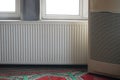 Heating unit next to window in indoor space during daytime Royalty Free Stock Photo