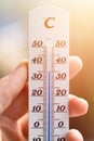 Heatwave: Thermometer in summer on a blurry background, heat