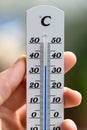 Heatwave: Thermometer in summer on a blurry background, heat