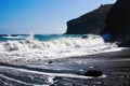 Heava violent surf waves crashing on secluded black lava sand beach bay  and rocks  - Cobquecura Piedra De La Loberia, Chile, Royalty Free Stock Photo