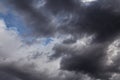 Epic Dramatic Storm sky, dark grey clouds against blue sky background texture, thunderstorm Royalty Free Stock Photo