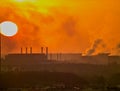 The rising sun over the steelworks in Ostrowiec Swietokrzyski . Royalty Free Stock Photo