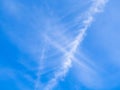 Heavenly background. Beautiful blue sky with white cross-shaped clouds in the sunlight. Divine heavenly light. Peaceful natural Royalty Free Stock Photo