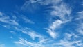 Scenic, heavenly blue skies with scattered cirrus clouds