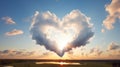 Heavenly heart cloud over a lake with the sun shinning through it. Representation of love, harmony, spiritual inner peace,