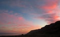 Bright colors at sunset over the sea: red clouds and blue sky Royalty Free Stock Photo