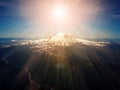 Heavenly rays of sunlight above mountain peak Royalty Free Stock Photo