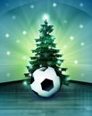 Heavenly space with soccer ball under glittering xmas tree