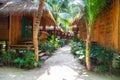 heavenly vacation on phi phi don island in thailand in a hotel with bamboo bungalow among palm trees Royalty Free Stock Photo