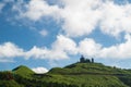 Heavenly Views: Mountain Peak\'s Clear Blue Sky and Moving White Clouds.