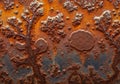 Heavily corroded metal surface displaying intricate rust patterns in shades of orange, brown, and Royalty Free Stock Photo