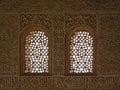 Heavily decorated wall with windows of Nasrid Palace , Alhambra, Spain