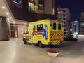 9 3 2022 Heavily equipped Ambulance and police van waiting to pick up a covid-19 or omicron patient near a residential building in Royalty Free Stock Photo