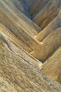 Heavily Eroded Ridges in golden canyon, Death Valley National Park Royalty Free Stock Photo