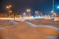 Heavily snow-covered road and sidewalk in an industrial town in Silesia, Poland, JastrzÃâ¢bie-Zdroj at night Royalty Free Stock Photo