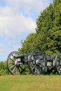 Heavy artillery canon set in open field Royalty Free Stock Photo