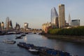 Heavy barge and tourist boats traffic on the river Thames in London, UK Royalty Free Stock Photo