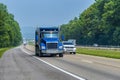 Heavy Blue Dump Truck On Interstate Highway With Copy Space