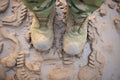 heavy boot imprint in soft mud, detailed
