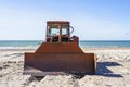 Heavy bulldozer as boat puller on the sand by the sea, front view Royalty Free Stock Photo