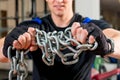 Heavy chain in the hands of the athlete Royalty Free Stock Photo