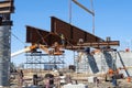 Heavy civil construction with workers placing steel bridge girders Royalty Free Stock Photo
