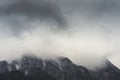 Heavy clouds of dense fog over Bucegi mountains Royalty Free Stock Photo
