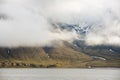 Heavy clouds over the arctic shore of the polar archipelago of Spitsbergen near Longyearbyen, Norway. Royalty Free Stock Photo