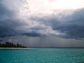 Heavy clouds and rain over the ocean Royalty Free Stock Photo