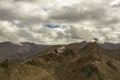 Heavy clouds in the sky over a Buddhist temple in the mountains Royalty Free Stock Photo