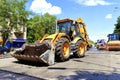 Heavy construction bulldozer and vibrating rollers during road construction