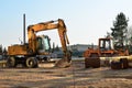 Heavy construction equipment and earthmoving excavators working on a construction site in the city. Royalty Free Stock Photo