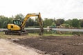 Heavy construction equipment. Yellow excavator on the construction site Royalty Free Stock Photo