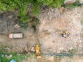 heavy construction machines clearing out pile of debris of destroyed building after house demolition Royalty Free Stock Photo