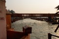 Heavy crowd going to take bath into ganga river due to saavan festival at haridwar bridge temple sky Royalty Free Stock Photo