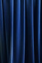 Heavy dark blue pleated textile curtain background