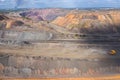 Heavy dump truck carrying the iron ore on the opencast mining aerial view. Royalty Free Stock Photo