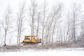 Heavy duty caterpillar bulldozer pushing down