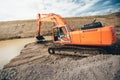 Heavy duty excavator at highway construction roadworks. Bulldozer and Excavator digging in soil Royalty Free Stock Photo