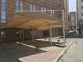 Heavy duty Fabric Tensile shade structures for an parking lot for the Customers of an reputed five star hotel building outdoor Royalty Free Stock Photo