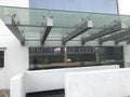 Heavy duty Glass portico or canopy supported by structural steel beams for the entrance of an government offices