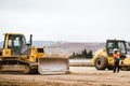 Industrial heavy duty machinery, details of excavator and engineer building highway Royalty Free Stock Photo